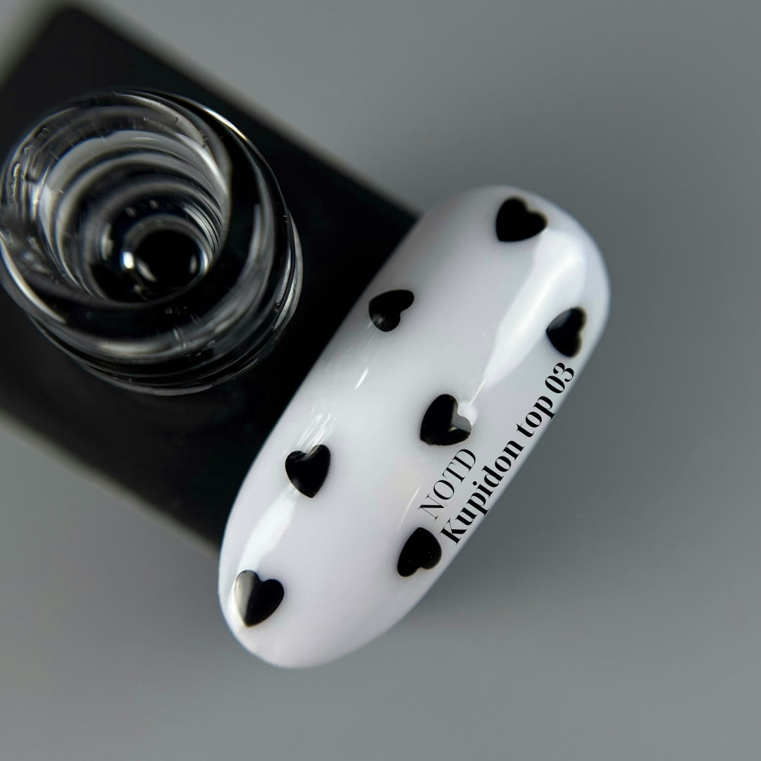 NAILSOFTHEDAY Kupidon top 03 — delicate finish for nails with deep black hearts, no sticky layer, 10 ml