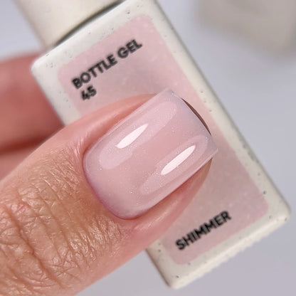 NAILSOFTHEDAY Bottle Gel 45 Shimmer — gel ultra-résistant beige laiteux avec shimmer argenté pour le renforcement des ongles, 10 ml