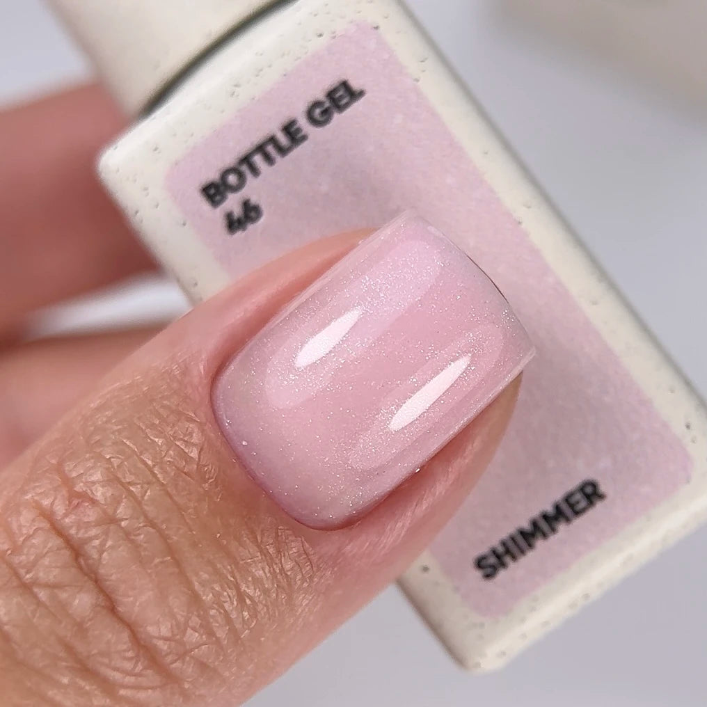 NAILSOFTHEDAY Bottle Gel 46 Shimmer — gel ultra-résistant rose laiteux avec shimmer argenté pour le renforcement des ongles, 10 ml