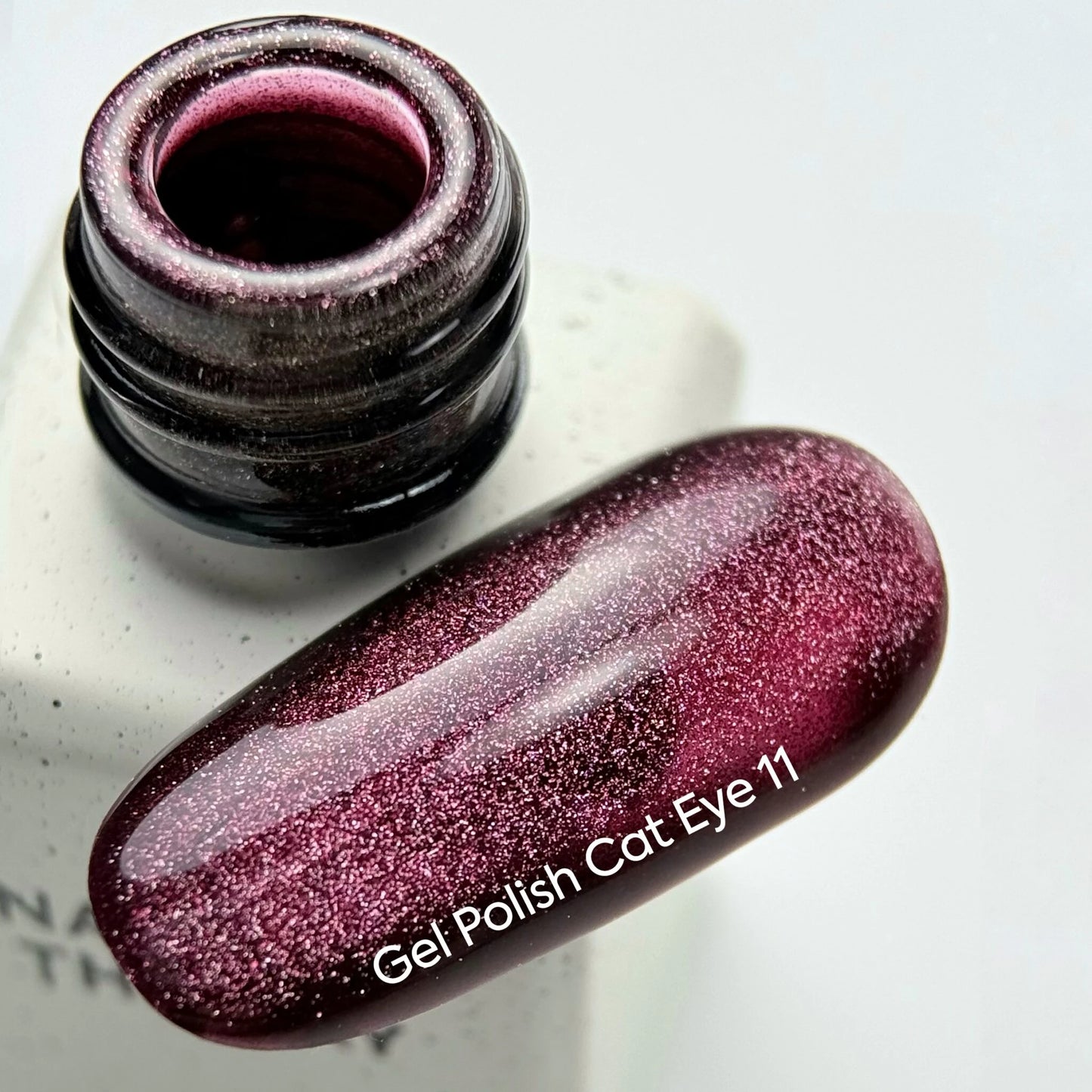 NAILSOFTHEDAY Gel Polish Cat Eye 11 — a deep raspberry cat eye gel polish with full coverage in one layer. 6 ml.