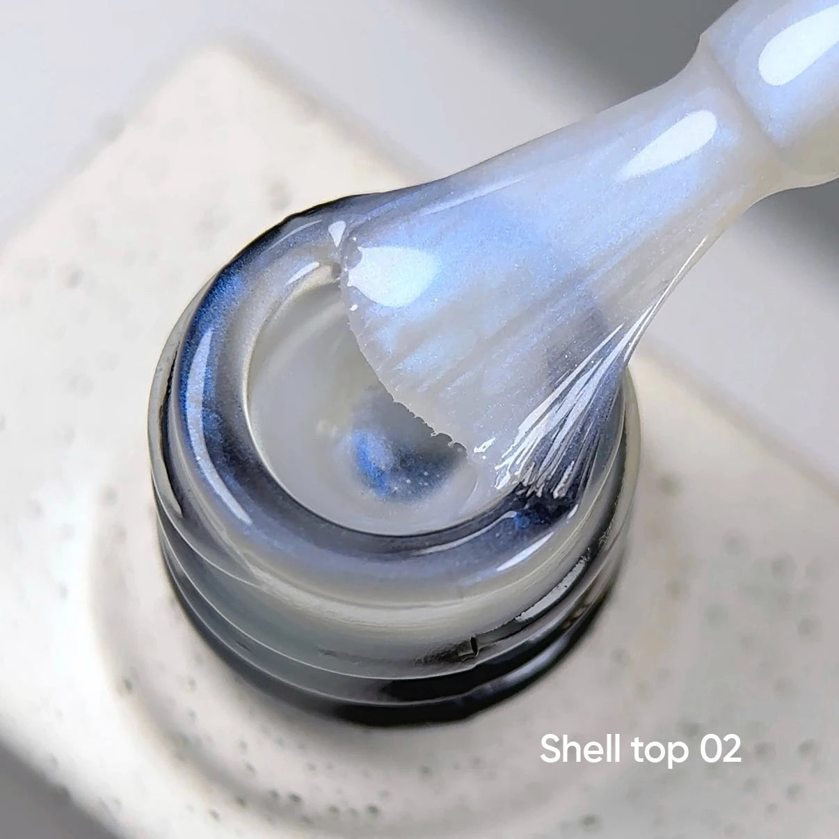 NAILSOFTHEDAY Shell Top 02 Nuova Formula — top perlato con effetto polvere blu, senza strato di dispersione, 10 ml
